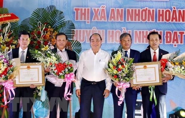 Le PM assiste a la ceremonie de reconnaissance de la Nouvelle ruralite a Binh Dinh hinh anh 1