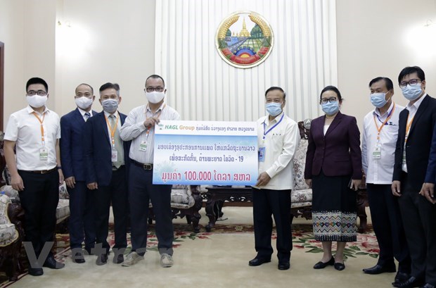 Coronavirus: des entreprises vietnamiennes aux cotes du gouvernement et du peuple du Laos hinh anh 1