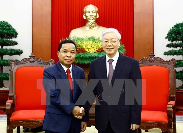 Le leader du PCV recoit une delegation du Parti populaire revolutionnaire du Laos hinh anh 1