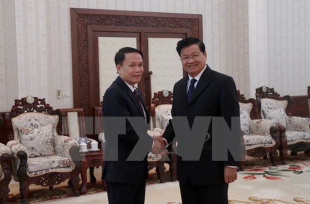 Le PM laotien salue le soutien de l'Agence vietnamienne d’information hinh anh 1