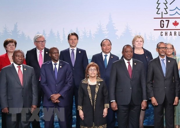 Le PM souligne la cooperation dans la lutte contre le changement climatique au sommet du G7 elargi hinh anh 1