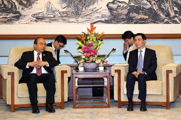 Le Vietnam attache de l'importance au developpement des relations avec la Chine hinh anh 1