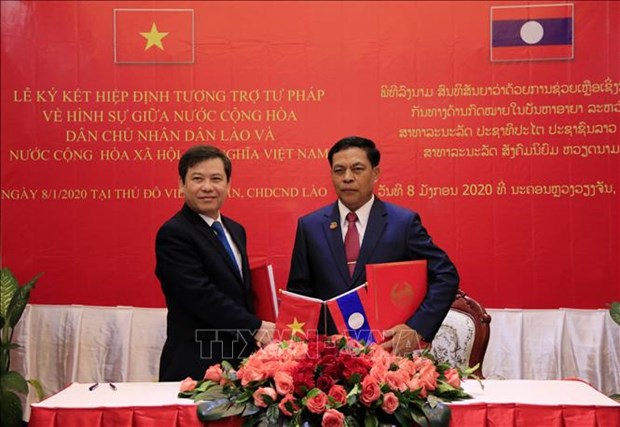 Les Parquets supremes du Vietnam et du Laos renforcent leur cooperation hinh anh 1