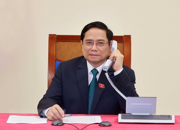 Felicitations du PM lao au nouveau Premier ministre vietnamien Pham Minh Chinh hinh anh 1