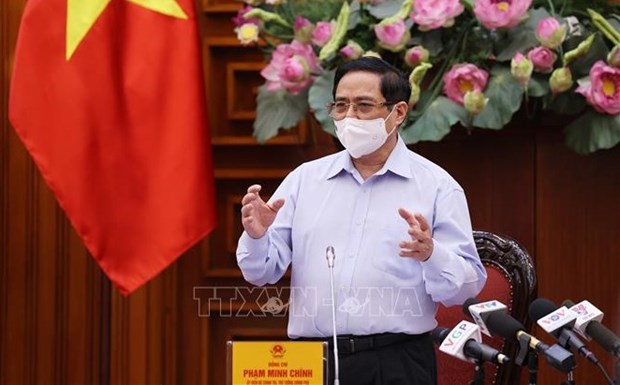 Le PM Pham Minh Chinh preside la reunion periodique du gouvernement de mai hinh anh 1