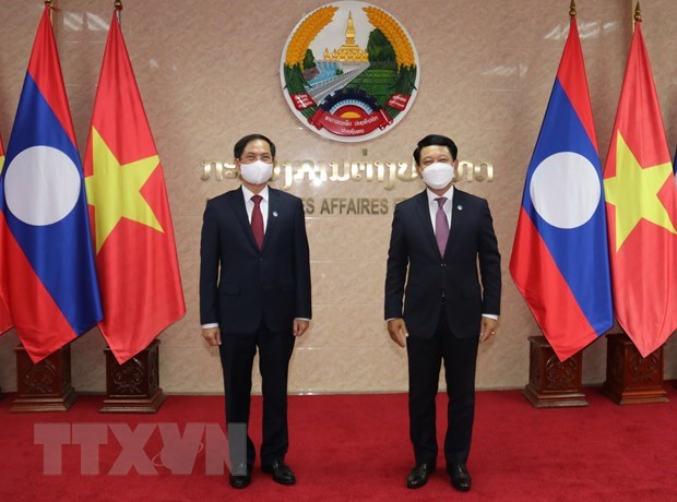 Le ministre des Affaires etrangeres travaille avec son homologue lao hinh anh 1
