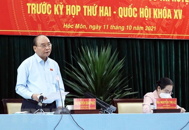 Le president Nguyen Xuan Phuc rencontre l’electorat de Cu Chi hinh anh 1