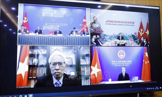 Vietnam-Chine: Reunion virtuelle sur les resultats de plenums des Comites centraux du PCV et du PCC hinh anh 2