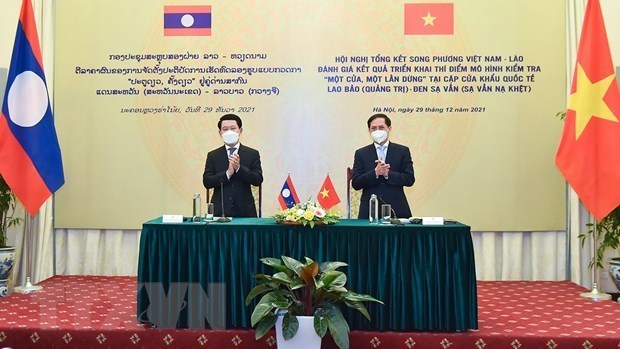Le Vietnam et Laos unis sur le modele a guichet unique aux postes-frontieres hinh anh 1