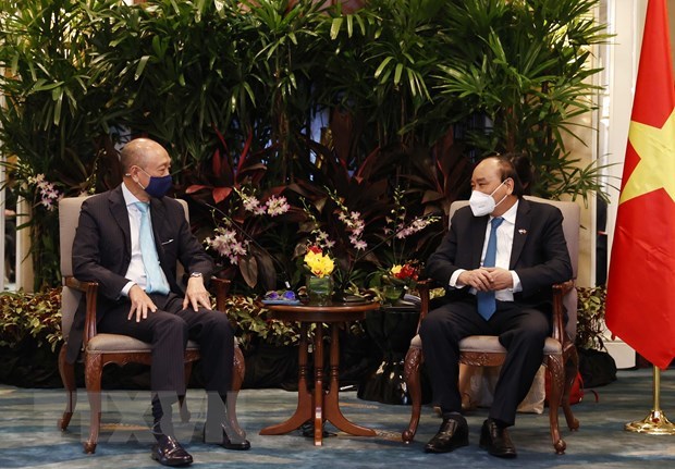 Le president Nguyen Xuan Phuc rencontre des entreprises singapouriennes hinh anh 1