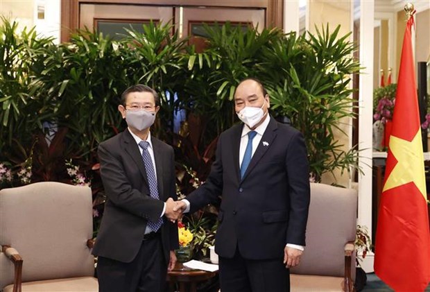 Le president Nguyen Xuan Phuc rencontre des entreprises singapouriennes hinh anh 3