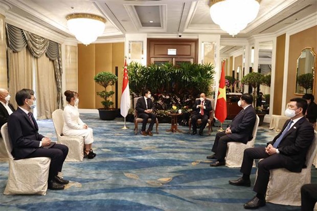 Le president Nguyen Xuan Phuc rencontre des entreprises singapouriennes hinh anh 7