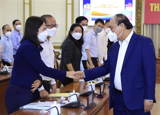 Le president Nguyen Xuan Phuc souligne le decollage economique de Hoc Mon et Cu Chi hinh anh 1