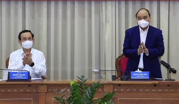 Le president Nguyen Xuan Phuc souligne le decollage economique de Hoc Mon et Cu Chi hinh anh 2