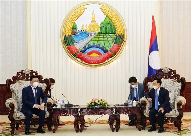 Les dirigeants lao apprecient la cooperation etroite entre Hanoi et Vientiane hinh anh 2