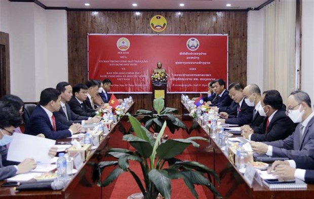 Le Vietnam et le Laos cooperent dans le domaine des affaires religieuses hinh anh 1