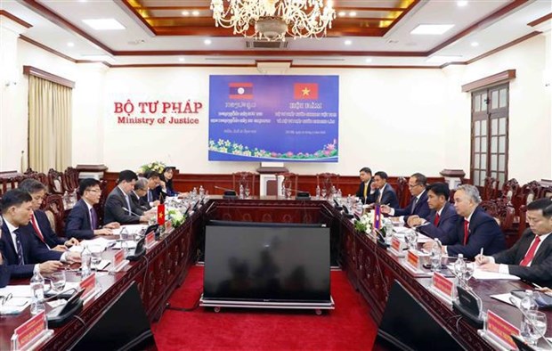 Renforcement de la cooperation entre les deux ministeres vietnamien et lao de la Justice hinh anh 1