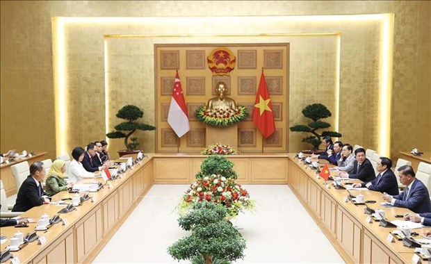 Le PM Pham Minh Chinh recoit la presidente singapourienne Halimah Yacob hinh anh 1