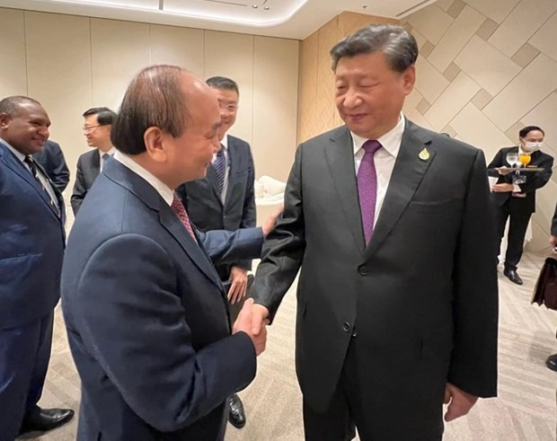 APEC: le president Nguyen Xuan Phuc rencontre le dirigeant chinois Xi Jinping hinh anh 1