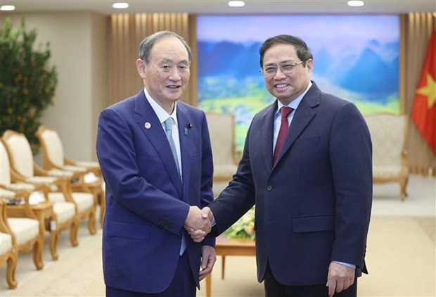 Le Premier ministre Pham Minh Chinh recoit l'ancien Premier ministre japonais Suga Yoshihide hinh anh 1