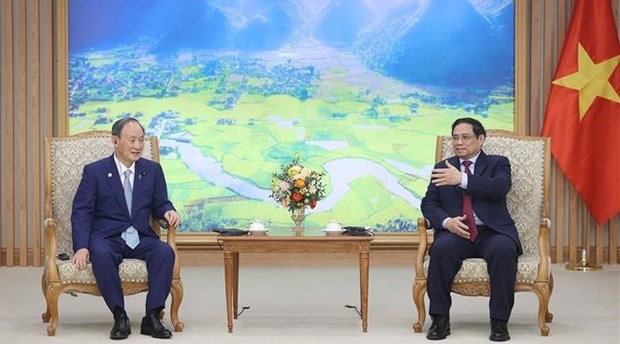 Le Premier ministre Pham Minh Chinh recoit l'ancien Premier ministre japonais Suga Yoshihide hinh anh 2