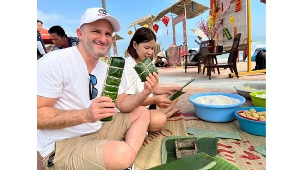 Les touristes etrangers s’en donnent a coeur joie dans le Tet au Vietnam hinh anh 1