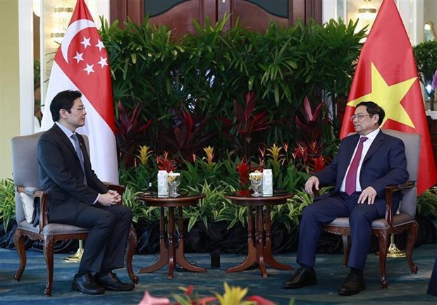 Le PM Pham Minh Chinh recoit un vice-Premier ministre singapourien hinh anh 2