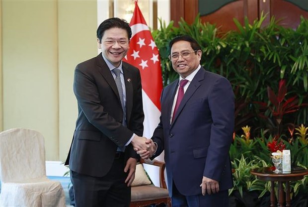 Le PM Pham Minh Chinh recoit un vice-Premier ministre singapourien hinh anh 1