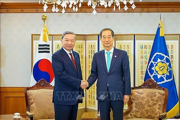 Le ministre de la Securite publique To Lam rencontre le PM sud-coreen Han Duck-soo hinh anh 1