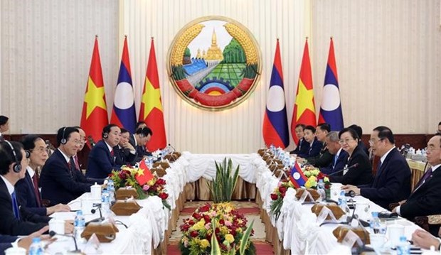 Le president Vo Van Thuong termine avec succes sa visite officielle au Laos hinh anh 1