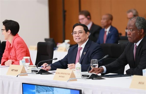 Le PM Pham Minh Chinh s’adresse a la 2e session du Sommet du G7 elargi hinh anh 1