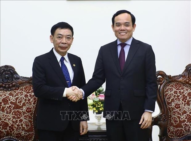 Le vice-PM Tran Luu Quang recoit le ministre laotien de l'Interieur Thongchanh Manixay hinh anh 1